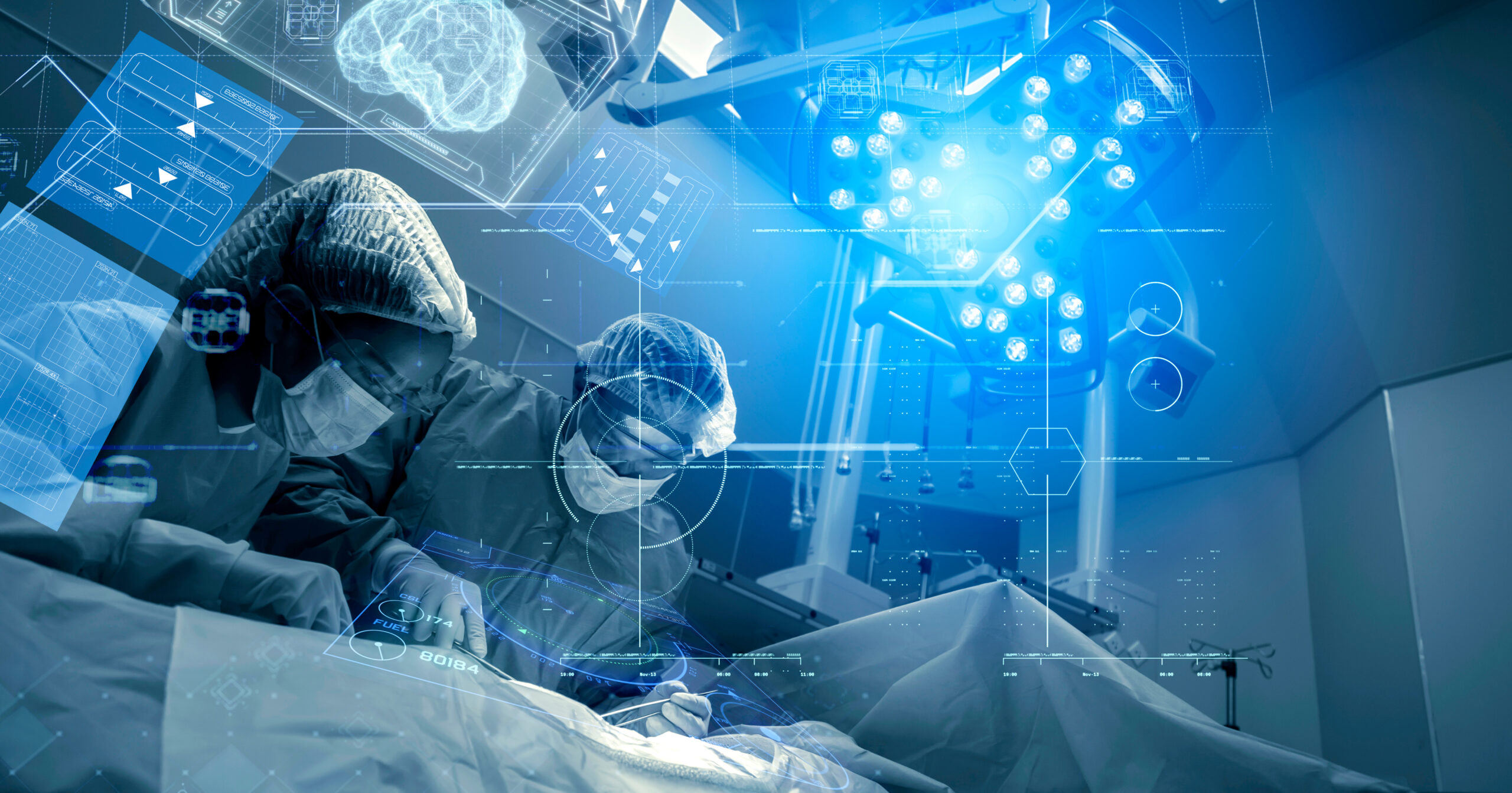 Surgeons wearing protective gear perform a complex operation in a high-tech operating room illuminated by blue surgical lights.