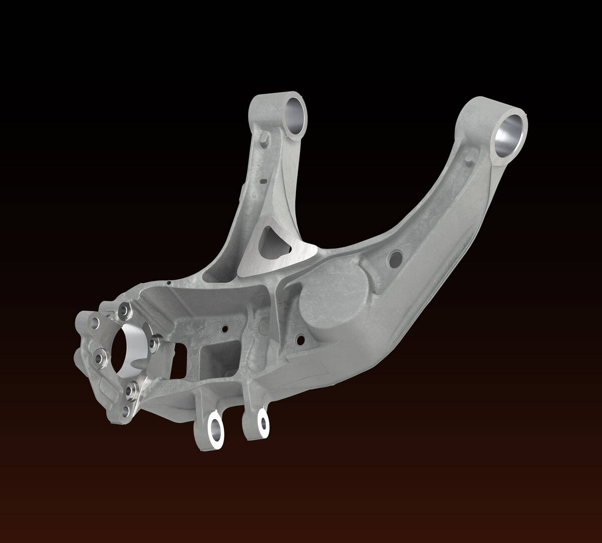 Close-up image of a silver metallic automotive suspension control arm part isolated on a black background.